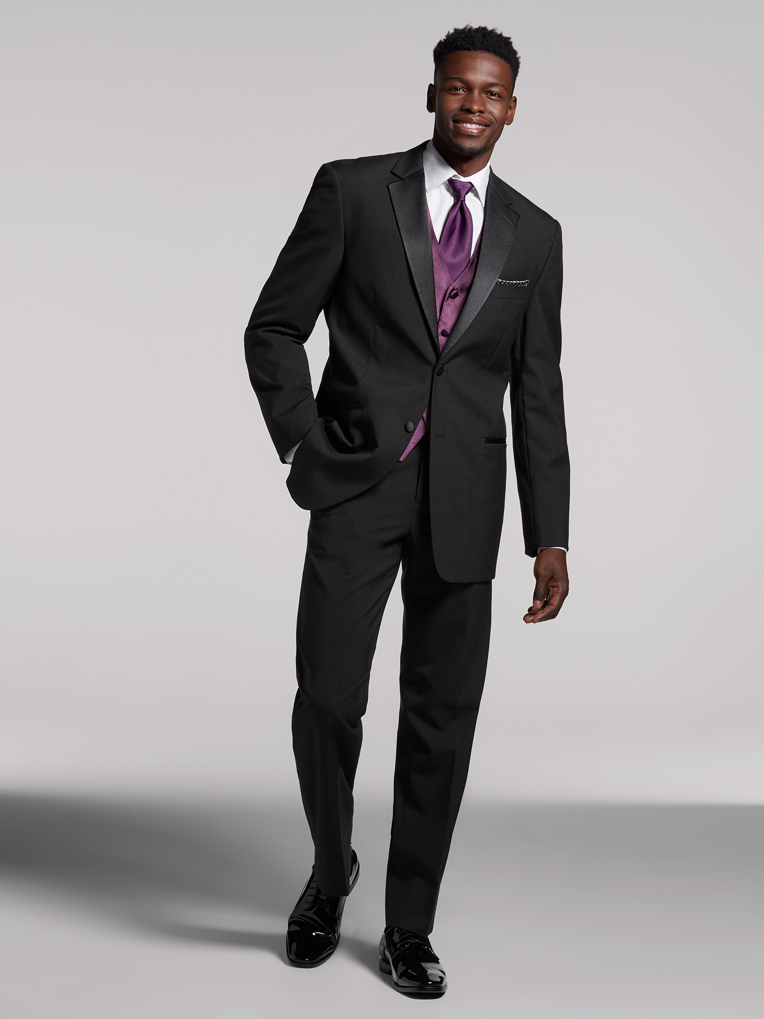 black suit black shirt purple tie